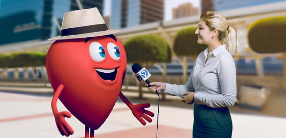 A female reporter holds a microphone to a cartoon-version of Bob's heart during an interview.