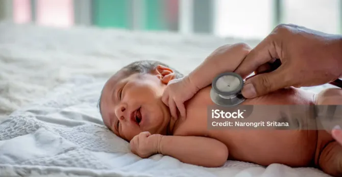 Soft blur of the doctor hands use stethoscope to check newborn baby health