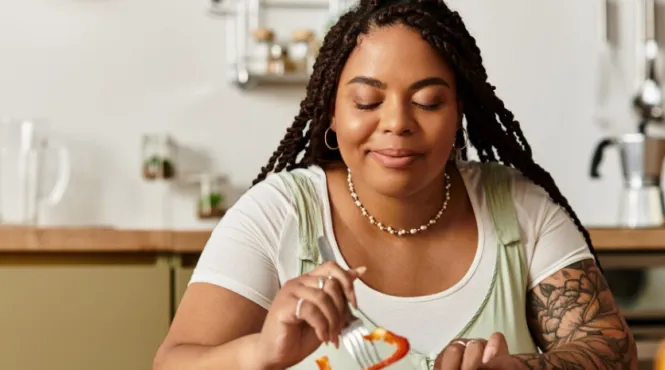 Women at a table eating mindfully enjoying each bite of food