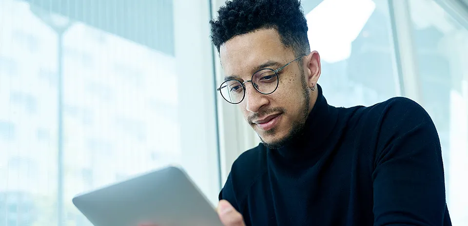 Image of man looking at computer