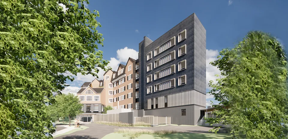 The gray and red exterior of the UMass Memorial Medical Center North Pavilion building.