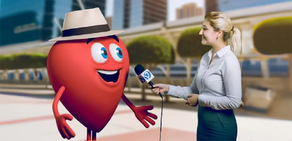 A female reporter holds a microphone to a cartoon-version of Bob's heart during an interview.