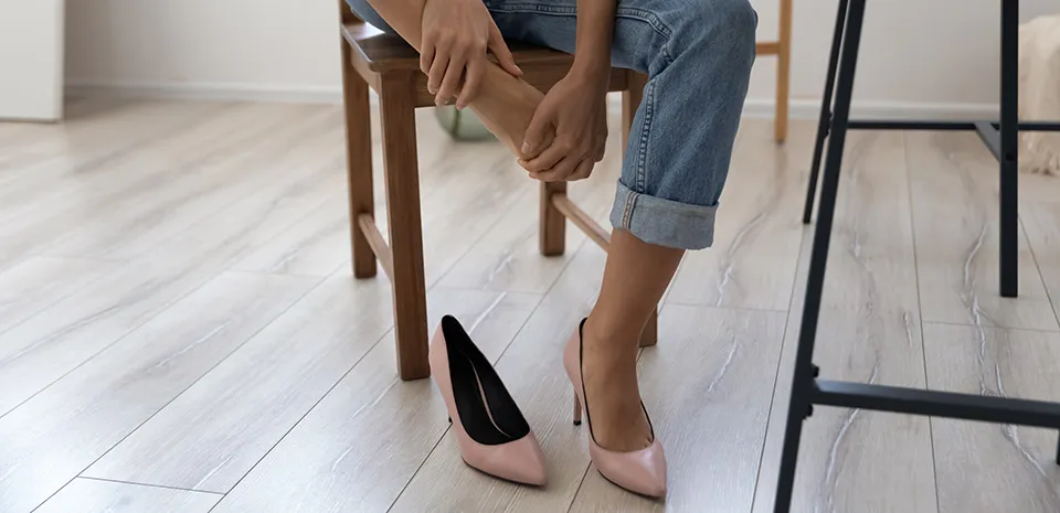 woman taking off her heels