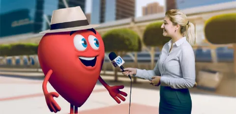 A female reporter holds a microphone to a cartoon-version of Bob's heart during an interview.