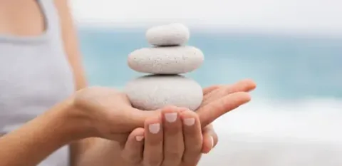 women practicing mindfulness on beach