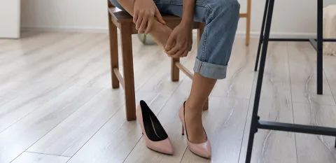 woman taking off her heels