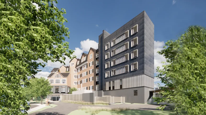 The gray and red exterior of the UMass Memorial Medical Center North Pavilion building.