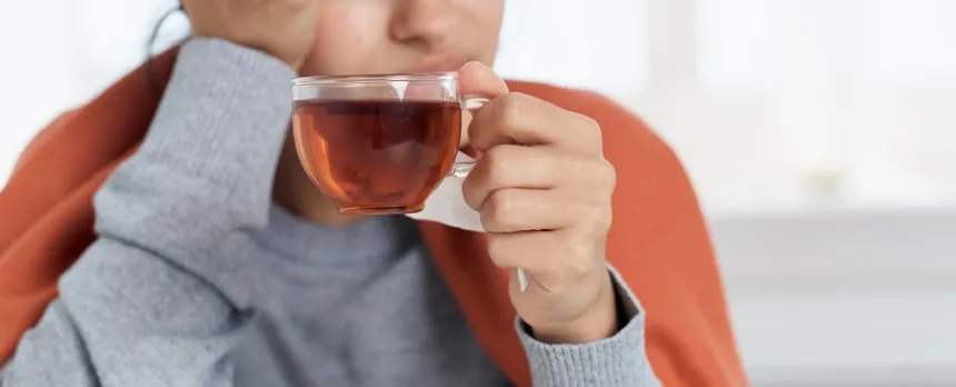 woman with Vomiting, Diarrhea and Dehydration drinking water