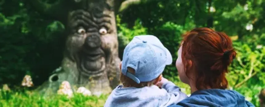 mother and child looking at mythical tree