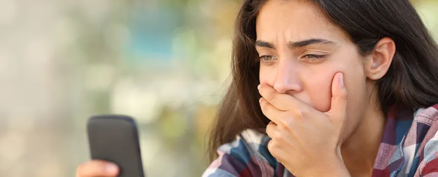 girl on mobile device watching tik toks