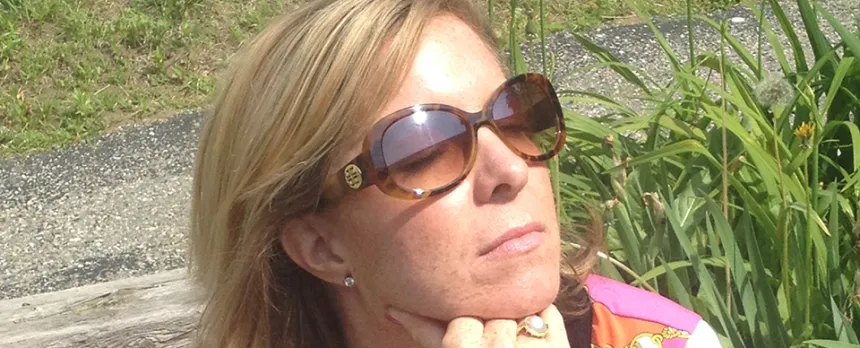 blonde woman sitting in the sun