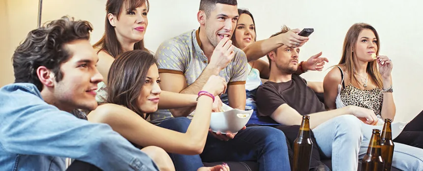 young adults drinking on couch