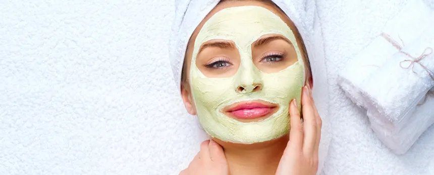 woman at the spa having a facial skin mask